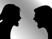 silhouette of a man and woman arguing